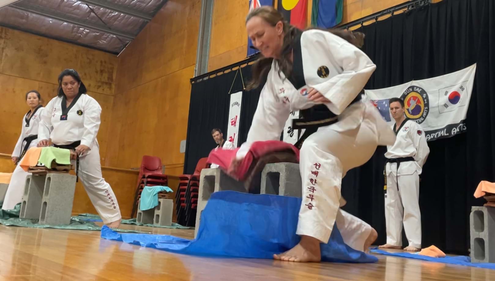 Tile power breaking, Champion, Sun Bae Korean Martial Art - Taekwondo Championship - Patterns, High Kick, Power Breaking, Roof Tiles, Kukkiwon, WT - World Taekwondo, Australia, Brisbane, Centres locations at Kenmore, Newmarket, The Gap, Middle Park, Mt Gravatt, Toowoomba, Grandmaster Bradley Tatnell. competition, white belt, yellow belt, blue belt, red belt, black belt, children, adults, male, female.