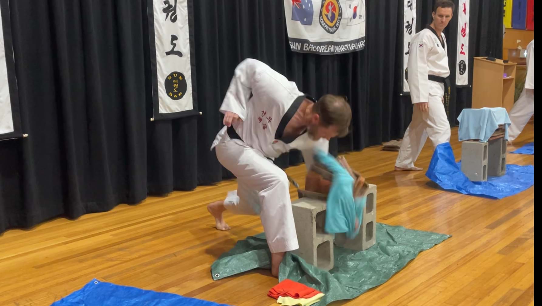 Tile power breaking, Champion, Sun Bae Korean Martial Art - Taekwondo Championship - Patterns, High Kick, Power Breaking, Roof Tiles, Kukkiwon, WT - World Taekwondo, Australia, Brisbane, Centres locations at Kenmore, Newmarket, The Gap, Middle Park, Mt Gravatt, Toowoomba, Grandmaster Bradley Tatnell. competition, white belt, yellow belt, blue belt, red belt, black belt, children, adults, male, female.