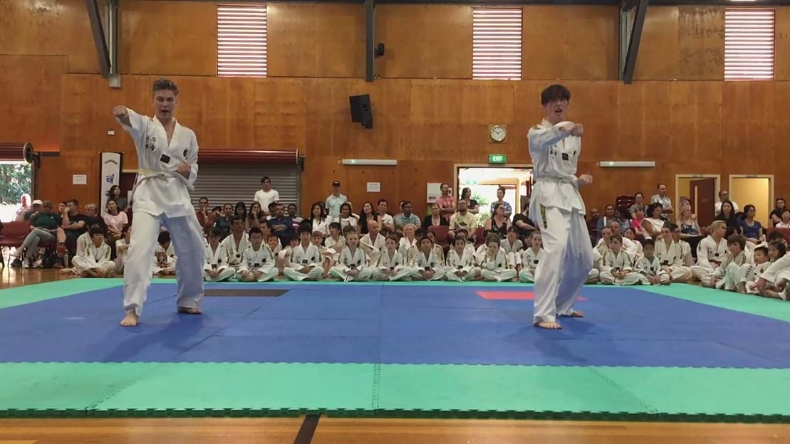 Taekwondo action - Sun Bae Korean Martial Art - Taekwondo Championship - Patterns, High Kick, Power Breaking, Roof Tiles, Kukkiwon, WT - World Taekwondo, Australia, Brisbane, Centres locations at Kenmore, Newmarket, The Gap, Middle Park, Mt Gravatt, Toowoomba, Grandmaster Bradley Tatnell. competition, white belt, yellow belt, blue belt, red belt, black belt, children, adults, male, female.