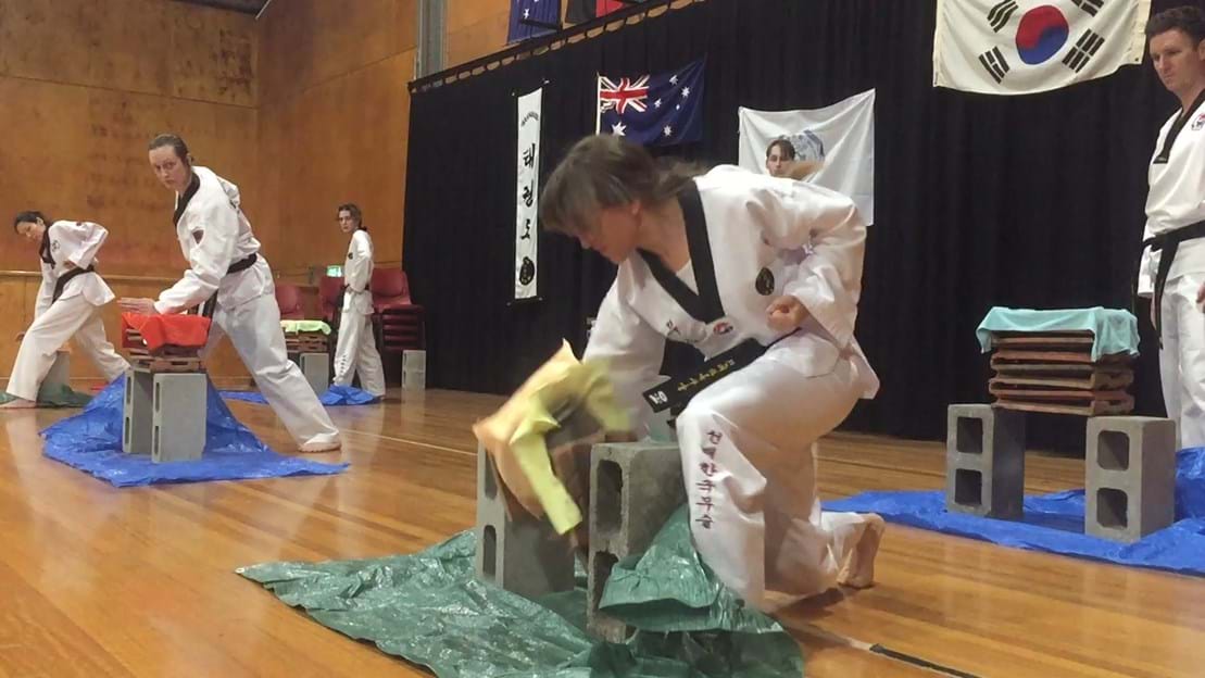 Taekwondo action - Sun Bae Korean Martial Art - Taekwondo Championship - Patterns, High Kick, Power Breaking, Roof Tiles, Kukkiwon, WT - World Taekwondo, Australia, Brisbane, Centres locations at Kenmore, Newmarket, The Gap, Middle Park, Mt Gravatt, Toowoomba, Grandmaster Bradley Tatnell. competition, white belt, yellow belt, blue belt, red belt, black belt, children, adults, male, female.