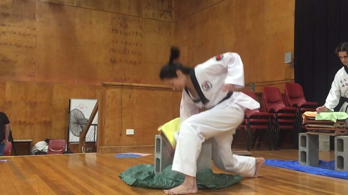 Taekwondo action - Sun Bae Korean Martial Art - Taekwondo Championship - Patterns, High Kick, Power Breaking, Roof Tiles, Kukkiwon, WT - World Taekwondo, Australia, Brisbane, Centres locations at Kenmore, Newmarket, The Gap, Middle Park, Mt Gravatt, Toowoomba, Grandmaster Bradley Tatnell. competition, white belt, yellow belt, blue belt, red belt, black belt, children, adults, male, female.