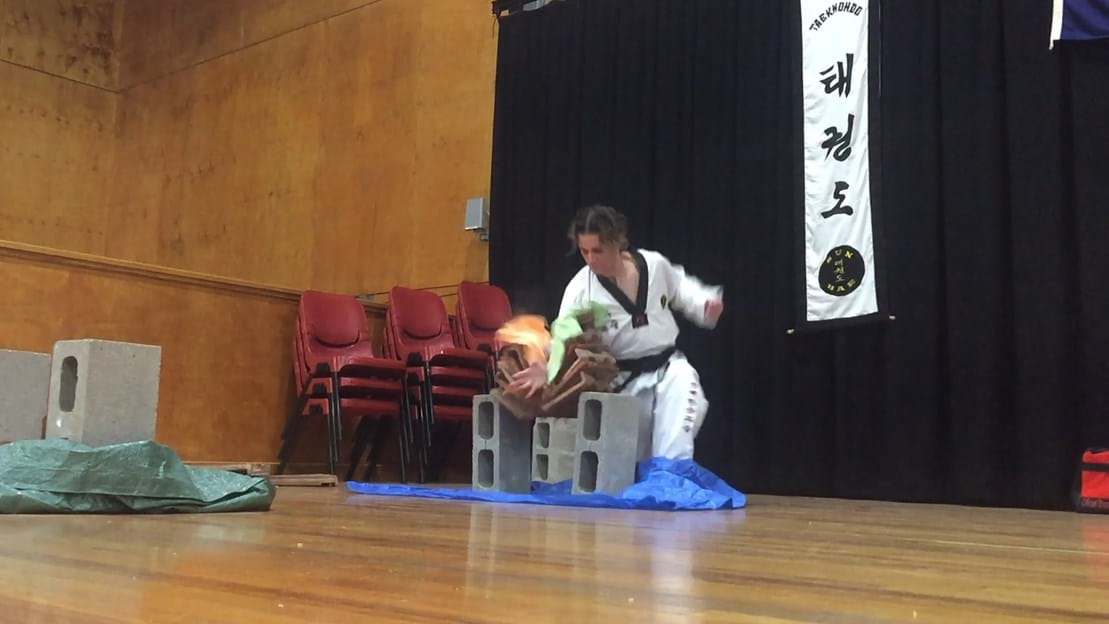 Taekwondo action - Sun Bae Korean Martial Art - Taekwondo Championship - Patterns, High Kick, Power Breaking, Roof Tiles, Kukkiwon, WT - World Taekwondo, Australia, Brisbane, Centres locations at Kenmore, Newmarket, The Gap, Middle Park, Mt Gravatt, Toowoomba, Grandmaster Bradley Tatnell. competition, white belt, yellow belt, blue belt, red belt, black belt, children, adults, male, female.