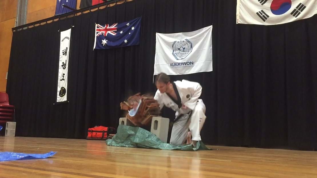 Taekwondo action - Sun Bae Korean Martial Art - Taekwondo Championship - Patterns, High Kick, Power Breaking, Roof Tiles, Kukkiwon, WT - World Taekwondo, Australia, Brisbane, Centres locations at Kenmore, Newmarket, The Gap, Middle Park, Mt Gravatt, Toowoomba, Grandmaster Bradley Tatnell. competition, white belt, yellow belt, blue belt, red belt, black belt, children, adults, male, female.