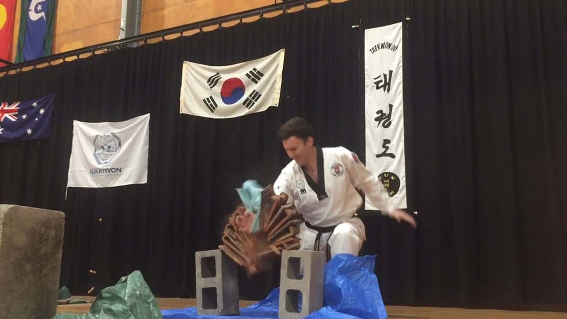 Taekwondo action - Sun Bae Korean Martial Art - Taekwondo Championship - Patterns, High Kick, Power Breaking, Roof Tiles, Kukkiwon, WT - World Taekwondo, Australia, Brisbane, Centres locations at Kenmore, Newmarket, The Gap, Middle Park, Mt Gravatt, Toowoomba, Grandmaster Bradley Tatnell. competition, white belt, yellow belt, blue belt, red belt, black belt, children, adults, male, female.