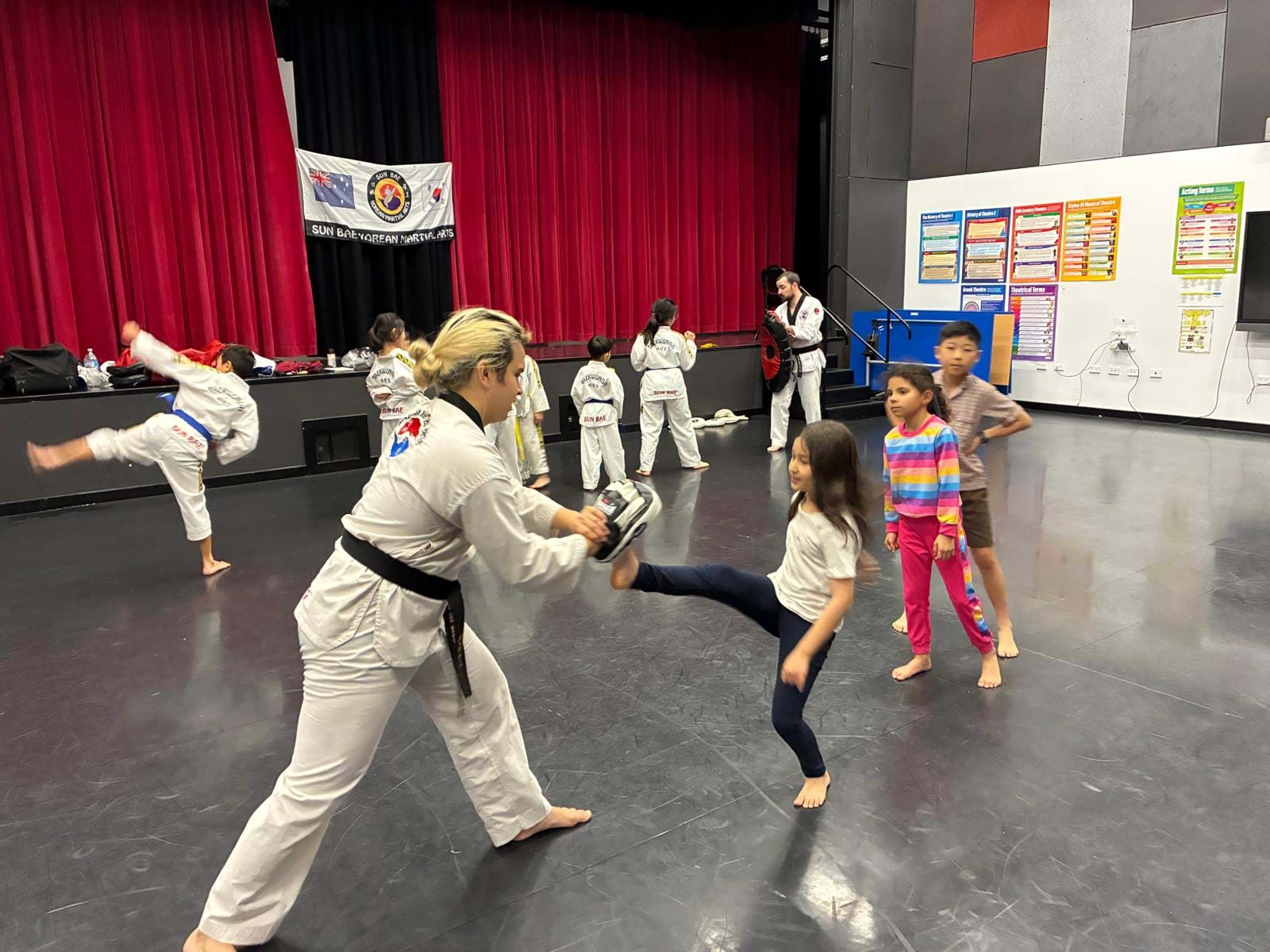 Kids Practice Front Kicks at Taekwondo Dojang Grand Opening