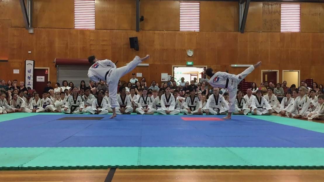 Taekwondo action - Sun Bae Korean Martial Art - Taekwondo Championship - Patterns, High Kick, Power Breaking, Roof Tiles, Kukkiwon, WT - World Taekwondo, Australia, Brisbane, Centres locations at Kenmore, Newmarket, The Gap, Middle Park, Mt Gravatt, Toowoomba, Grandmaster Bradley Tatnell. competition, white belt, yellow belt, blue belt, red belt, black belt, children, adults, male, female.