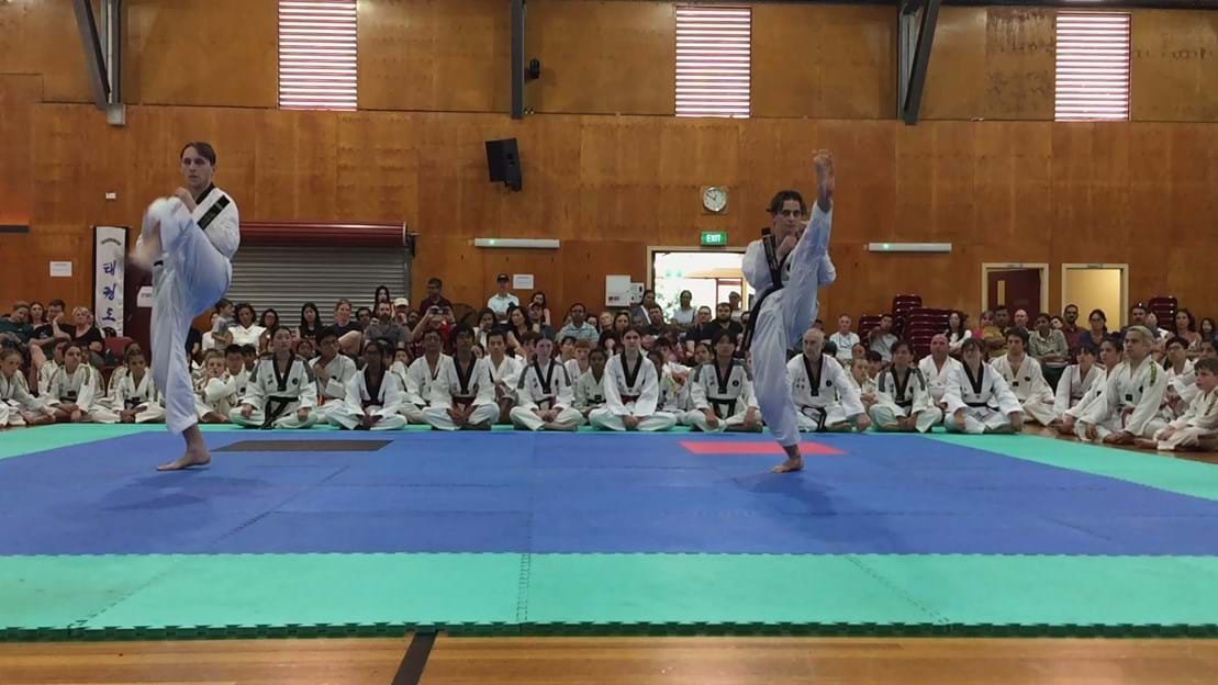 Taekwondo action - Sun Bae Korean Martial Art - Taekwondo Championship - Patterns, High Kick, Power Breaking, Roof Tiles, Kukkiwon, WT - World Taekwondo, Australia, Brisbane, Centres locations at Kenmore, Newmarket, The Gap, Middle Park, Mt Gravatt, Toowoomba, Grandmaster Bradley Tatnell. competition, white belt, yellow belt, blue belt, red belt, black belt, children, adults, male, female.