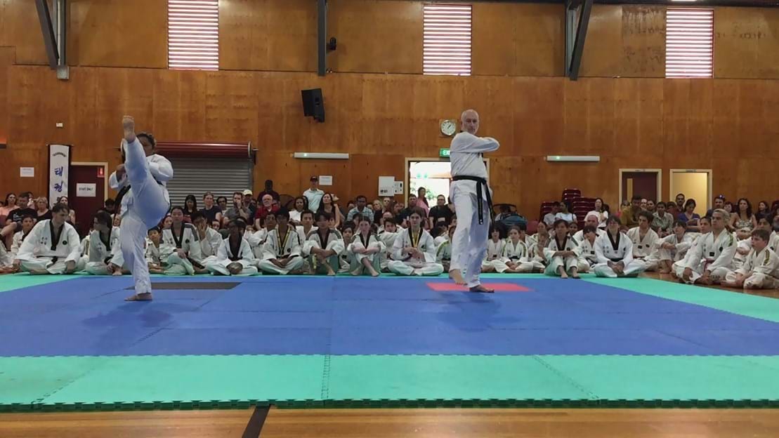 Taekwondo action - Sun Bae Korean Martial Art - Taekwondo Championship - Patterns, High Kick, Power Breaking, Roof Tiles, Kukkiwon, WT - World Taekwondo, Australia, Brisbane, Centres locations at Kenmore, Newmarket, The Gap, Middle Park, Mt Gravatt, Toowoomba, Grandmaster Bradley Tatnell. competition, white belt, yellow belt, blue belt, red belt, black belt, children, adults, male, female.