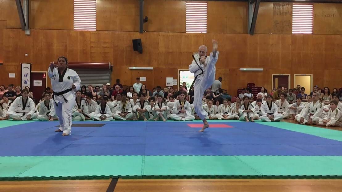 Taekwondo action - Sun Bae Korean Martial Art - Taekwondo Championship - Patterns, High Kick, Power Breaking, Roof Tiles, Kukkiwon, WT - World Taekwondo, Australia, Brisbane, Centres locations at Kenmore, Newmarket, The Gap, Middle Park, Mt Gravatt, Toowoomba, Grandmaster Bradley Tatnell. competition, white belt, yellow belt, blue belt, red belt, black belt, children, adults, male, female.