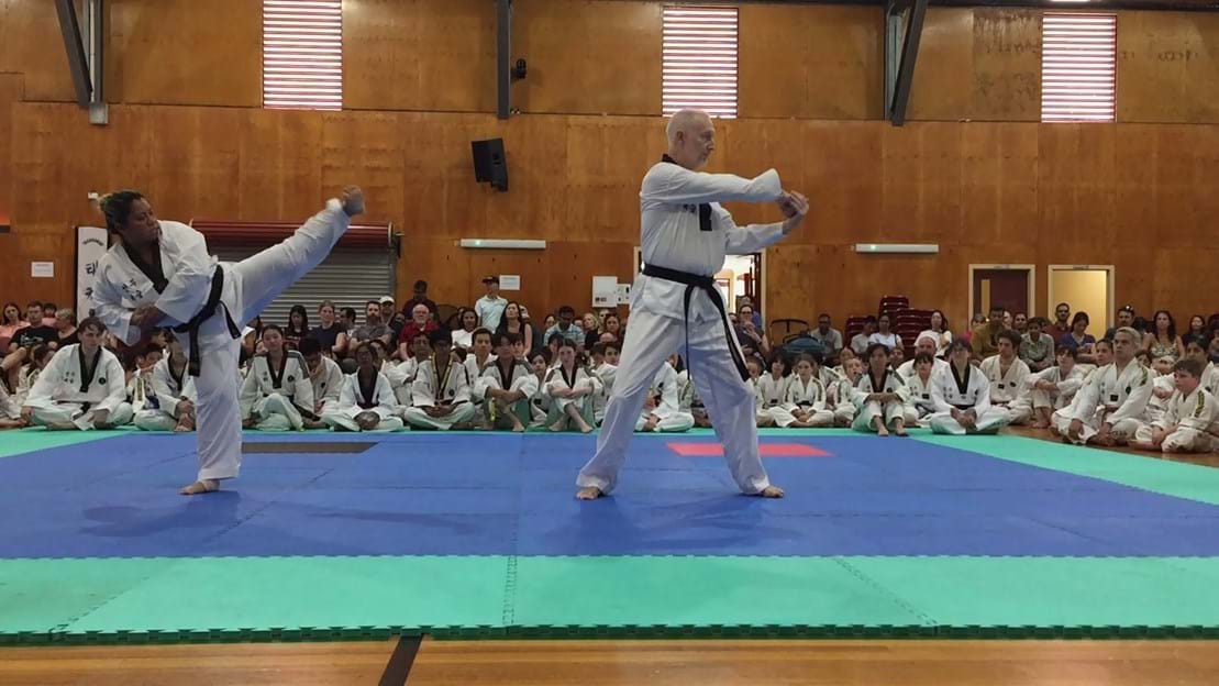 Taekwondo action - Sun Bae Korean Martial Art - Taekwondo Championship - Patterns, High Kick, Power Breaking, Roof Tiles, Kukkiwon, WT - World Taekwondo, Australia, Brisbane, Centres locations at Kenmore, Newmarket, The Gap, Middle Park, Mt Gravatt, Toowoomba, Grandmaster Bradley Tatnell. competition, white belt, yellow belt, blue belt, red belt, black belt, children, adults, male, female.
