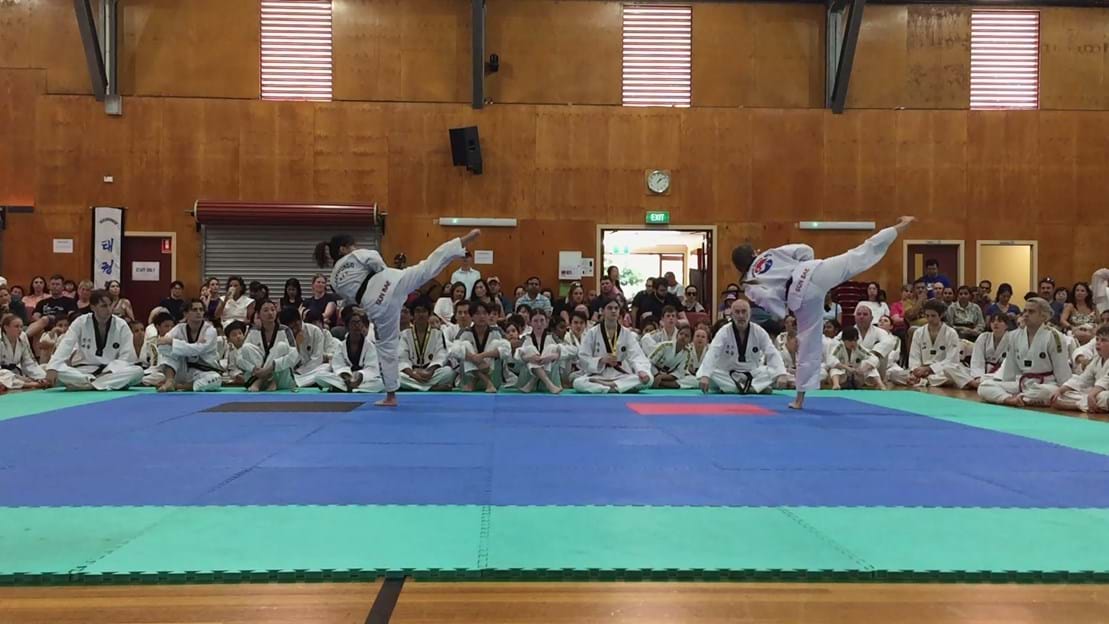 Taekwondo action - Sun Bae Korean Martial Art - Taekwondo Championship - Patterns, High Kick, Power Breaking, Roof Tiles, Kukkiwon, WT - World Taekwondo, Australia, Brisbane, Centres locations at Kenmore, Newmarket, The Gap, Middle Park, Mt Gravatt, Toowoomba, Grandmaster Bradley Tatnell. competition, white belt, yellow belt, blue belt, red belt, black belt, children, adults, male, female.