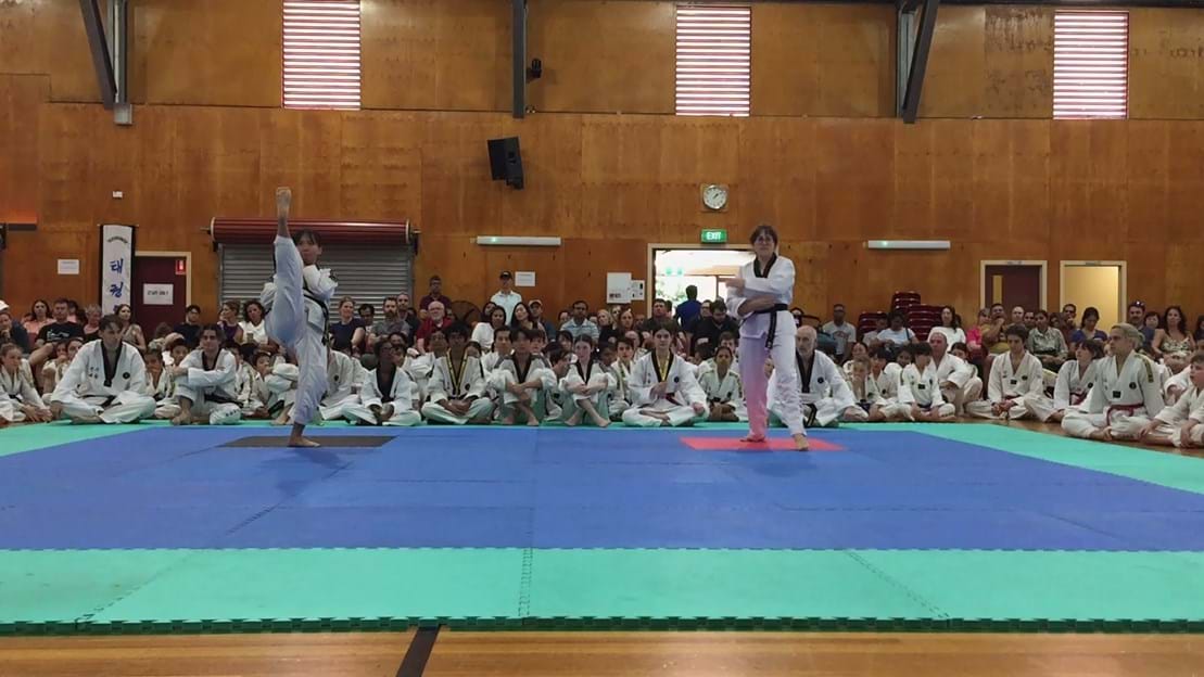 Taekwondo action - Sun Bae Korean Martial Art - Taekwondo Championship - Patterns, High Kick, Power Breaking, Roof Tiles, Kukkiwon, WT - World Taekwondo, Australia, Brisbane, Centres locations at Kenmore, Newmarket, The Gap, Middle Park, Mt Gravatt, Toowoomba, Grandmaster Bradley Tatnell. competition, white belt, yellow belt, blue belt, red belt, black belt, children, adults, male, female.