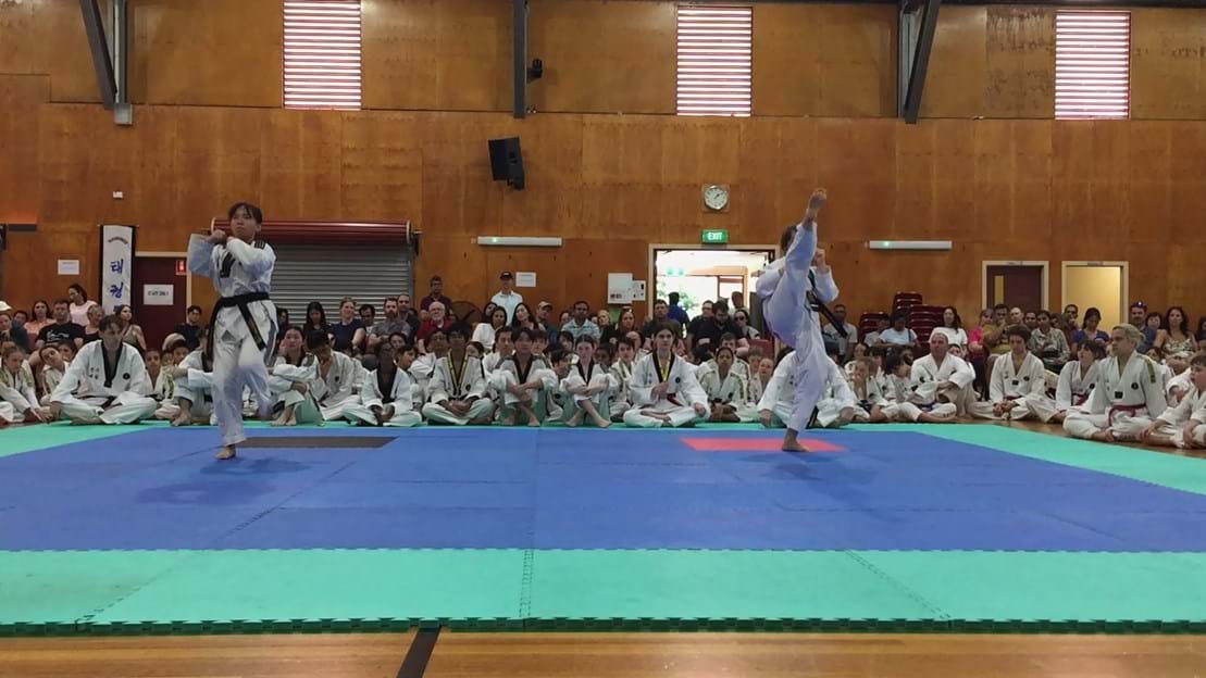 Taekwondo action - Sun Bae Korean Martial Art - Taekwondo Championship - Patterns, High Kick, Power Breaking, Roof Tiles, Kukkiwon, WT - World Taekwondo, Australia, Brisbane, Centres locations at Kenmore, Newmarket, The Gap, Middle Park, Mt Gravatt, Toowoomba, Grandmaster Bradley Tatnell. competition, white belt, yellow belt, blue belt, red belt, black belt, children, adults, male, female.