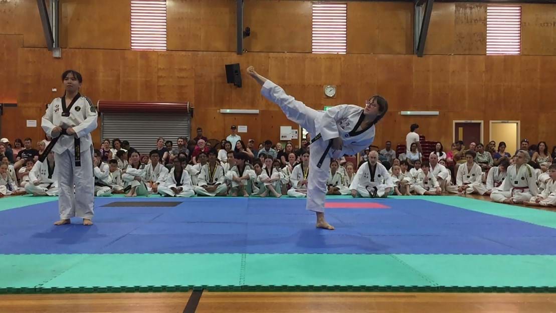 Taekwondo action - Sun Bae Korean Martial Art - Taekwondo Championship - Patterns, High Kick, Power Breaking, Roof Tiles, Kukkiwon, WT - World Taekwondo, Australia, Brisbane, Centres locations at Kenmore, Newmarket, The Gap, Middle Park, Mt Gravatt, Toowoomba, Grandmaster Bradley Tatnell. competition, white belt, yellow belt, blue belt, red belt, black belt, children, adults, male, female.