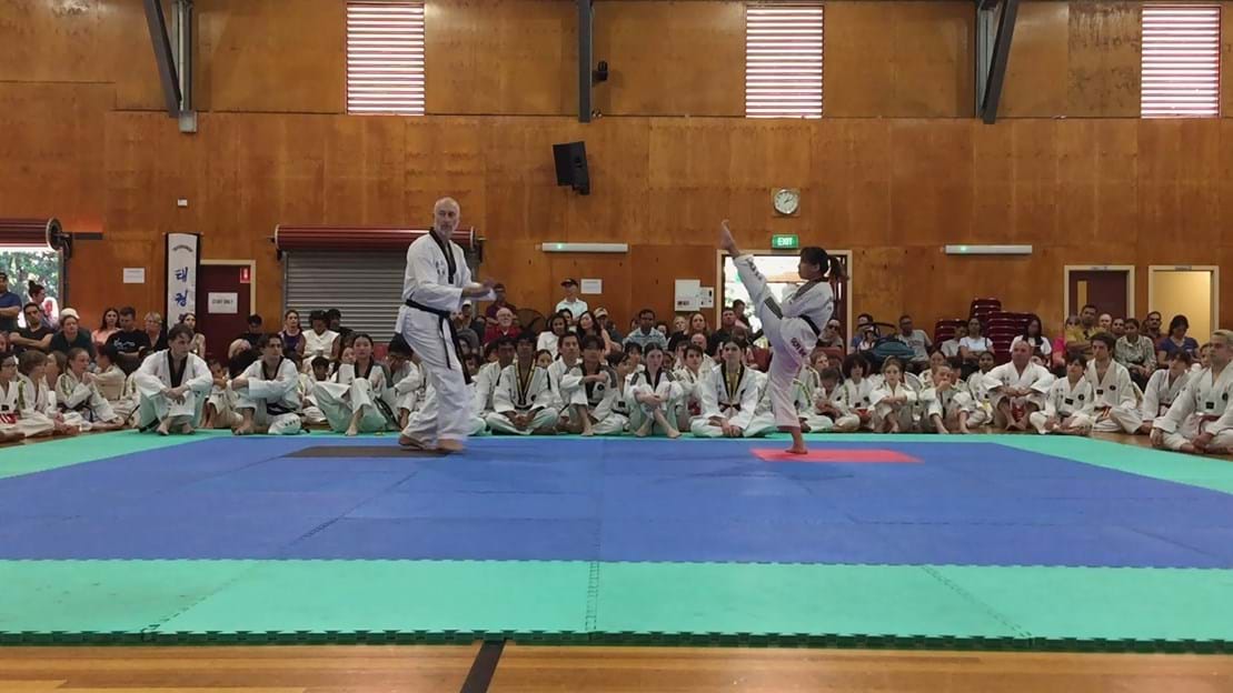 Taekwondo action - Sun Bae Korean Martial Art - Taekwondo Championship - Patterns, High Kick, Power Breaking, Roof Tiles, Kukkiwon, WT - World Taekwondo, Australia, Brisbane, Centres locations at Kenmore, Newmarket, The Gap, Middle Park, Mt Gravatt, Toowoomba, Grandmaster Bradley Tatnell. competition, white belt, yellow belt, blue belt, red belt, black belt, children, adults, male, female.