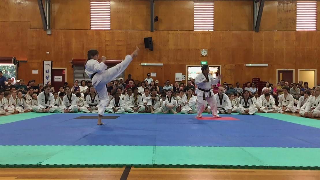Taekwondo action - Sun Bae Korean Martial Art - Taekwondo Championship - Patterns, High Kick, Power Breaking, Roof Tiles, Kukkiwon, WT - World Taekwondo, Australia, Brisbane, Centres locations at Kenmore, Newmarket, The Gap, Middle Park, Mt Gravatt, Toowoomba, Grandmaster Bradley Tatnell. competition, white belt, yellow belt, blue belt, red belt, black belt, children, adults, male, female.