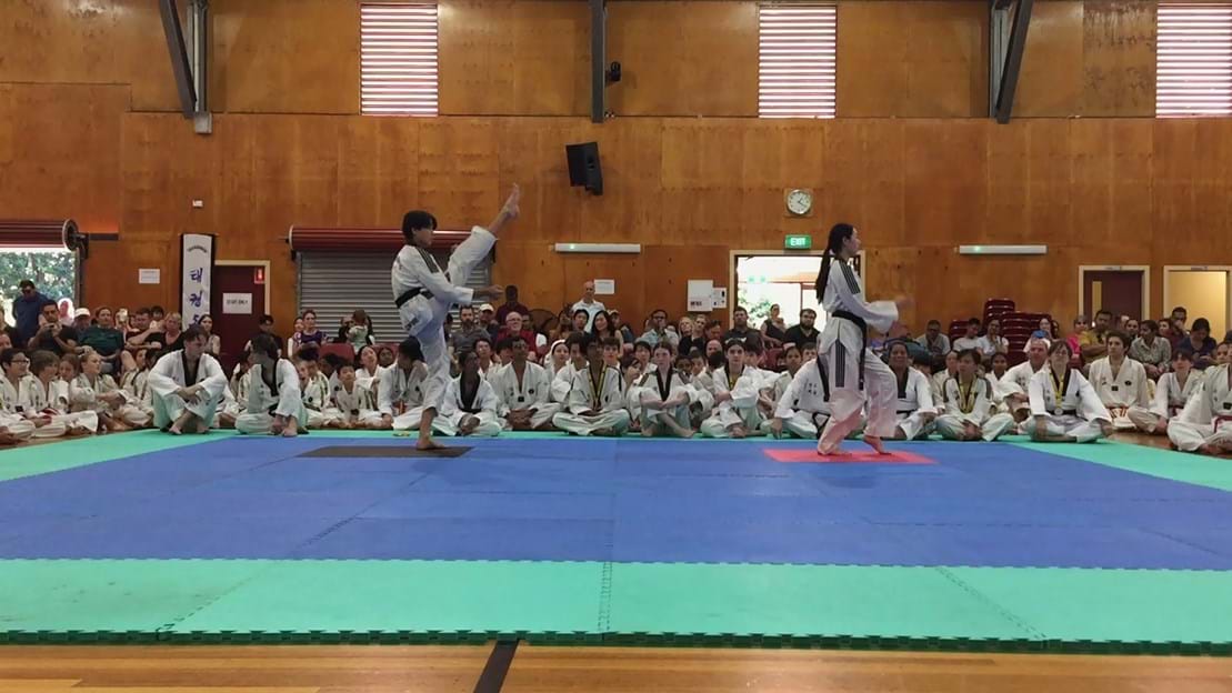 Taekwondo action - Sun Bae Korean Martial Art - Taekwondo Championship - Patterns, High Kick, Power Breaking, Roof Tiles, Kukkiwon, WT - World Taekwondo, Australia, Brisbane, Centres locations at Kenmore, Newmarket, The Gap, Middle Park, Mt Gravatt, Toowoomba, Grandmaster Bradley Tatnell. competition, white belt, yellow belt, blue belt, red belt, black belt, children, adults, male, female.
