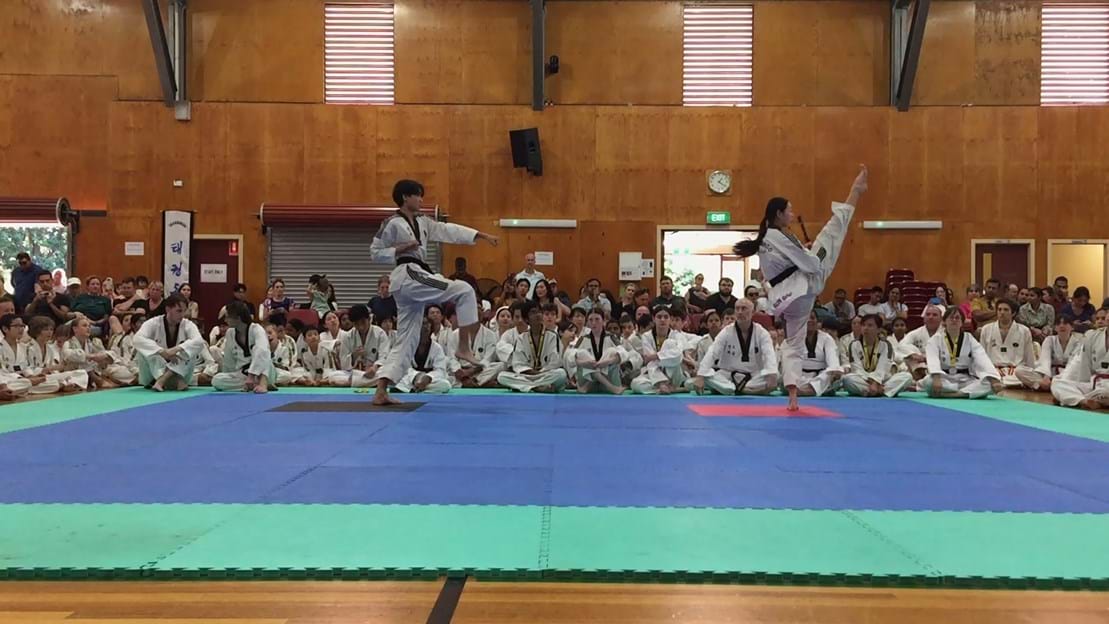 Taekwondo action - Sun Bae Korean Martial Art - Taekwondo Championship - Patterns, High Kick, Power Breaking, Roof Tiles, Kukkiwon, WT - World Taekwondo, Australia, Brisbane, Centres locations at Kenmore, Newmarket, The Gap, Middle Park, Mt Gravatt, Toowoomba, Grandmaster Bradley Tatnell. competition, white belt, yellow belt, blue belt, red belt, black belt, children, adults, male, female.