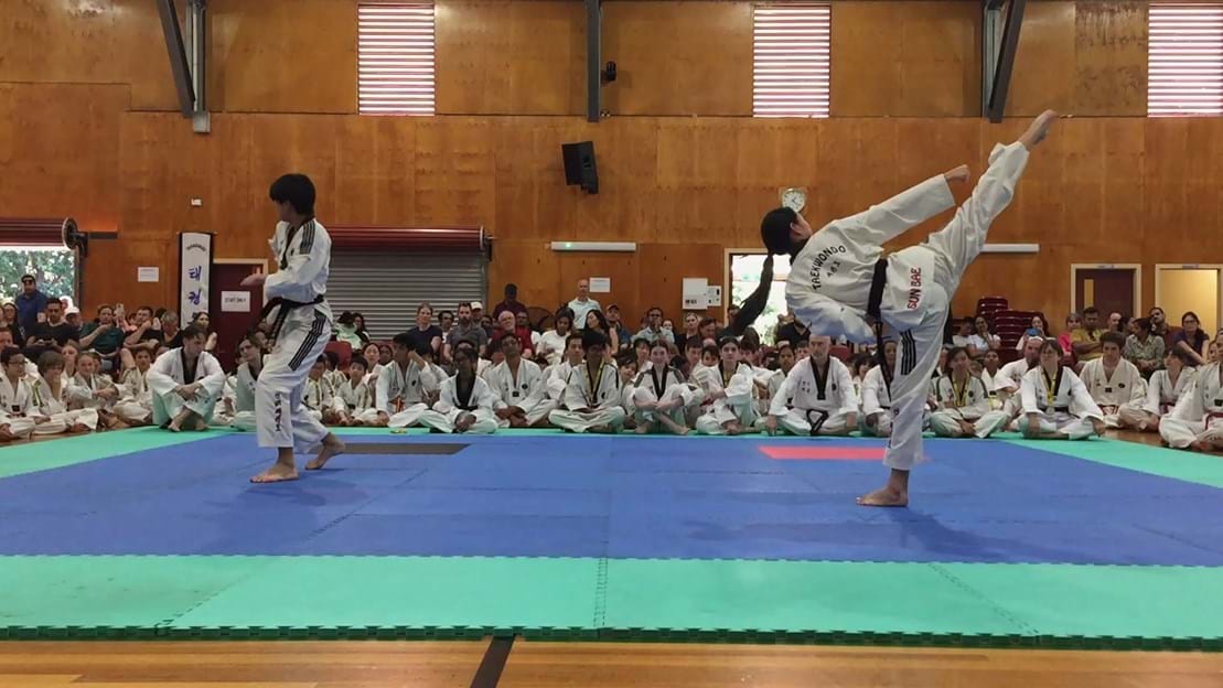 Taekwondo action - Sun Bae Korean Martial Art - Taekwondo Championship - Patterns, High Kick, Power Breaking, Roof Tiles, Kukkiwon, WT - World Taekwondo, Australia, Brisbane, Centres locations at Kenmore, Newmarket, The Gap, Middle Park, Mt Gravatt, Toowoomba, Grandmaster Bradley Tatnell. competition, white belt, yellow belt, blue belt, red belt, black belt, children, adults, male, female.