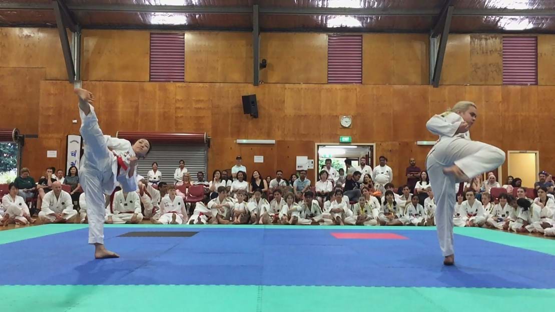 Taekwondo action - Sun Bae Korean Martial Art - Taekwondo Championship - Patterns, High Kick, Power Breaking, Roof Tiles, Kukkiwon, WT - World Taekwondo, Australia, Brisbane, Centres locations at Kenmore, Newmarket, The Gap, Middle Park, Mt Gravatt, Toowoomba, Grandmaster Bradley Tatnell. competition, white belt, yellow belt, blue belt, red belt, black belt, children, adults, male, female.