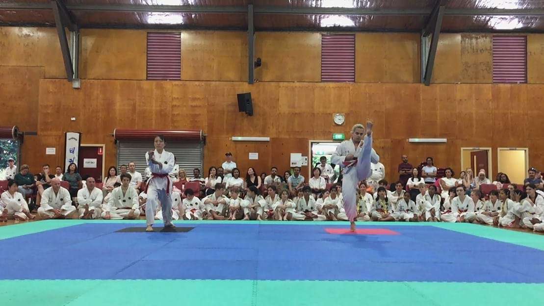 Taekwondo action - Sun Bae Korean Martial Art - Taekwondo Championship - Patterns, High Kick, Power Breaking, Roof Tiles, Kukkiwon, WT - World Taekwondo, Australia, Brisbane, Centres locations at Kenmore, Newmarket, The Gap, Middle Park, Mt Gravatt, Toowoomba, Grandmaster Bradley Tatnell. competition, white belt, yellow belt, blue belt, red belt, black belt, children, adults, male, female.