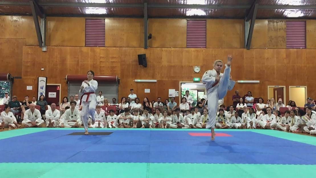 Taekwondo action - Sun Bae Korean Martial Art - Taekwondo Championship - Patterns, High Kick, Power Breaking, Roof Tiles, Kukkiwon, WT - World Taekwondo, Australia, Brisbane, Centres locations at Kenmore, Newmarket, The Gap, Middle Park, Mt Gravatt, Toowoomba, Grandmaster Bradley Tatnell. competition, white belt, yellow belt, blue belt, red belt, black belt, children, adults, male, female.