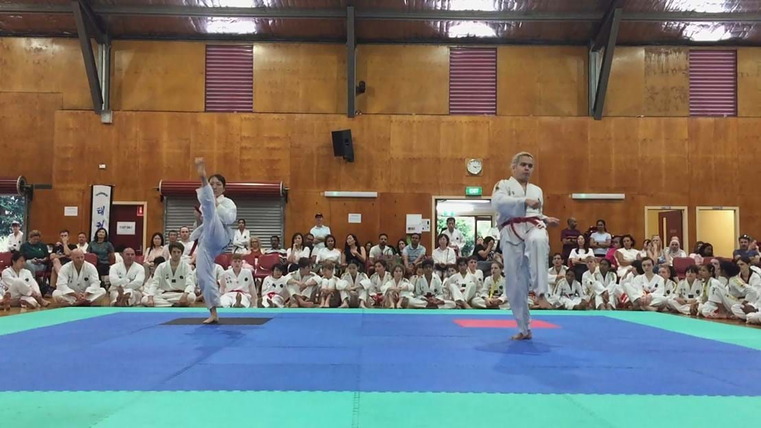 Taekwondo action - Sun Bae Korean Martial Art - Taekwondo Championship - Patterns, High Kick, Power Breaking, Roof Tiles, Kukkiwon, WT - World Taekwondo, Australia, Brisbane, Centres locations at Kenmore, Newmarket, The Gap, Middle Park, Mt Gravatt, Toowoomba, Grandmaster Bradley Tatnell. competition, white belt, yellow belt, blue belt, red belt, black belt, children, adults, male, female.