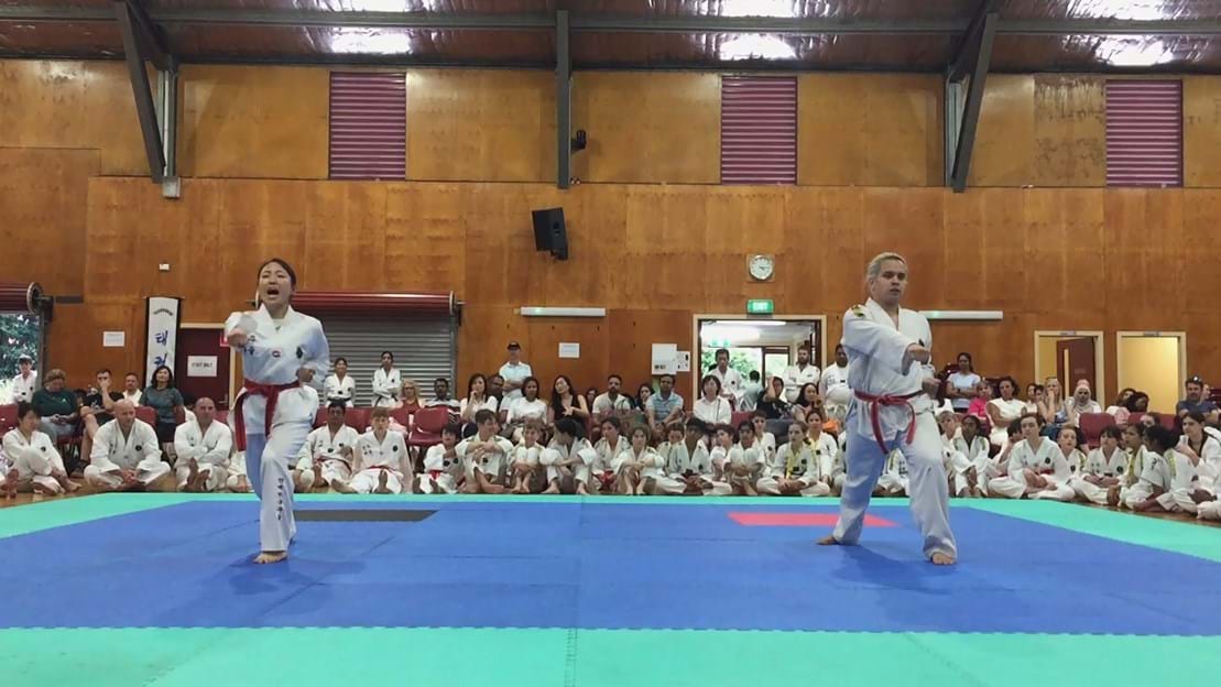 Taekwondo action - Sun Bae Korean Martial Art - Taekwondo Championship - Patterns, High Kick, Power Breaking, Roof Tiles, Kukkiwon, WT - World Taekwondo, Australia, Brisbane, Centres locations at Kenmore, Newmarket, The Gap, Middle Park, Mt Gravatt, Toowoomba, Grandmaster Bradley Tatnell. competition, white belt, yellow belt, blue belt, red belt, black belt, children, adults, male, female.