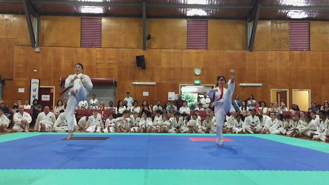 Taekwondo action - Sun Bae Korean Martial Art - Taekwondo Championship - Patterns, High Kick, Power Breaking, Roof Tiles, Kukkiwon, WT - World Taekwondo, Australia, Brisbane, Centres locations at Kenmore, Newmarket, The Gap, Middle Park, Mt Gravatt, Toowoomba, Grandmaster Bradley Tatnell. competition, white belt, yellow belt, blue belt, red belt, black belt, children, adults, male, female.