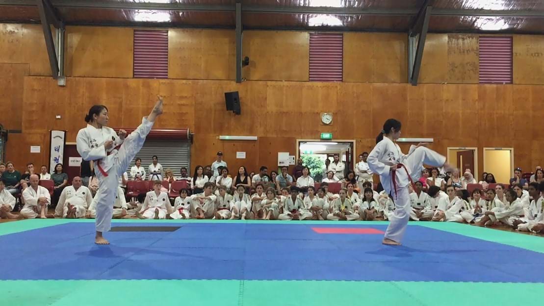 Taekwondo action - Sun Bae Korean Martial Art - Taekwondo Championship - Patterns, High Kick, Power Breaking, Roof Tiles, Kukkiwon, WT - World Taekwondo, Australia, Brisbane, Centres locations at Kenmore, Newmarket, The Gap, Middle Park, Mt Gravatt, Toowoomba, Grandmaster Bradley Tatnell. competition, white belt, yellow belt, blue belt, red belt, black belt, children, adults, male, female.