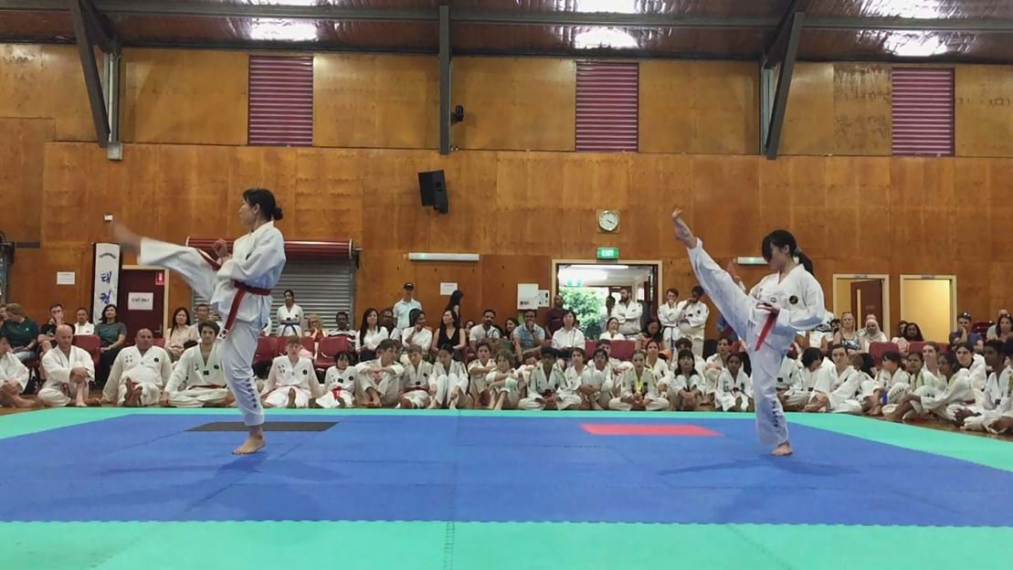 Taekwondo action - Sun Bae Korean Martial Art - Taekwondo Championship - Patterns, High Kick, Power Breaking, Roof Tiles, Kukkiwon, WT - World Taekwondo, Australia, Brisbane, Centres locations at Kenmore, Newmarket, The Gap, Middle Park, Mt Gravatt, Toowoomba, Grandmaster Bradley Tatnell. competition, white belt, yellow belt, blue belt, red belt, black belt, children, adults, male, female.
