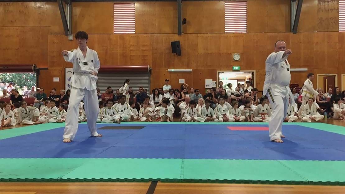 Taekwondo action - Sun Bae Korean Martial Art - Taekwondo Championship - Patterns, High Kick, Power Breaking, Roof Tiles, Kukkiwon, WT - World Taekwondo, Australia, Brisbane, Centres locations at Kenmore, Newmarket, The Gap, Middle Park, Mt Gravatt, Toowoomba, Grandmaster Bradley Tatnell. competition, white belt, yellow belt, blue belt, red belt, black belt, children, adults, male, female.