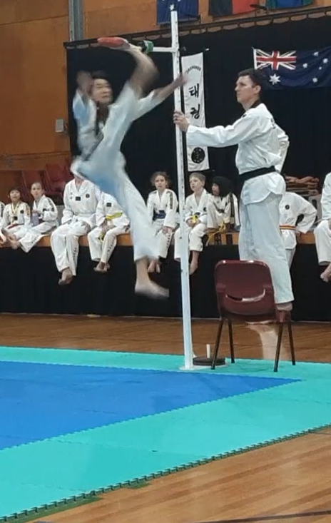Male highest kick, Sam Yang, Champion, Sun Bae Korean Martial Art - Taekwondo Championship - Patterns, High Kick, Power Breaking, Roof Tiles, Kukkiwon, WT - World Taekwondo, Australia, Brisbane, Centres locations at Kenmore, Newmarket, The Gap, Middle Park, Mt Gravatt, Toowoomba, Grandmaster Bradley Tatnell. competition, white belt, yellow belt, blue belt, red belt, black belt, children, adults, male, female.