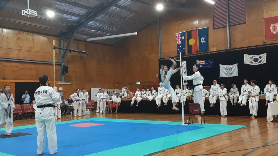 Taekwondo action - Sun Bae Korean Martial Art - Taekwondo Championship - Patterns, High Kick, Power Breaking, Roof Tiles, Kukkiwon, WT - World Taekwondo, Australia, Brisbane, Centres locations at Kenmore, Newmarket, The Gap, Middle Park, Mt Gravatt, Toowoomba, Grandmaster Bradley Tatnell. competition, white belt, yellow belt, blue belt, red belt, black belt, children, adults, male, female.