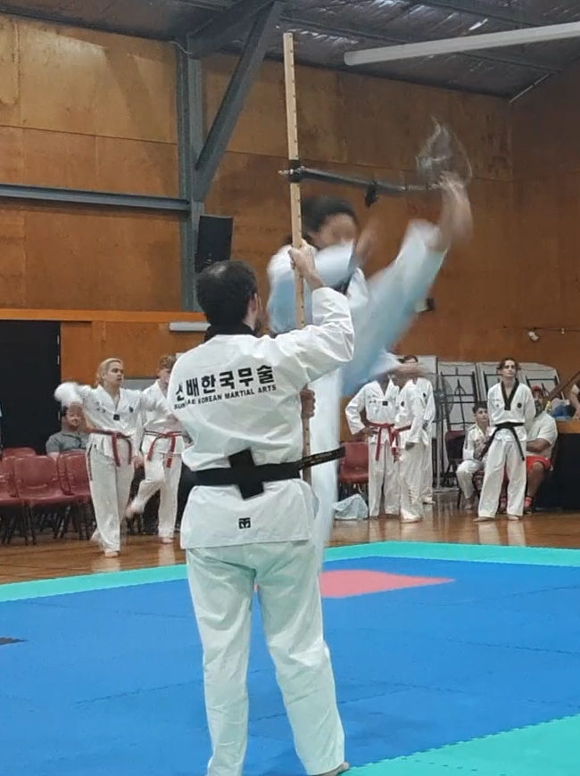 Female highest kick, Shirly Sieh, Champion, Sun Bae Korean Martial Art - Taekwondo Championship - Patterns, High Kick, Power Breaking, Roof Tiles, Kukkiwon, WT - World Taekwondo, Australia, Brisbane, Centres locations at Kenmore, Newmarket, The Gap, Middle Park, Mt Gravatt, Toowoomba, Grandmaster Bradley Tatnell. competition, white belt, yellow belt, blue belt, red belt, black belt, children, adults, male, female.