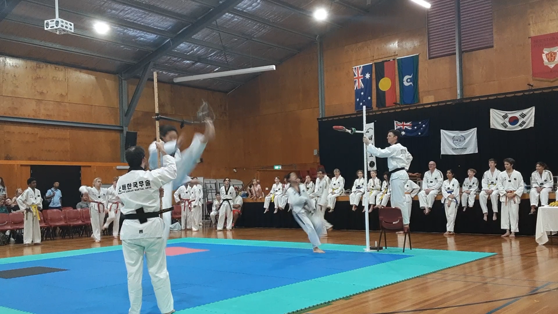 Taekwondo action - Sun Bae Korean Martial Art - Taekwondo Championship - Patterns, High Kick, Power Breaking, Roof Tiles, Kukkiwon, WT - World Taekwondo, Australia, Brisbane, Centres locations at Kenmore, Newmarket, The Gap, Middle Park, Mt Gravatt, Toowoomba, Grandmaster Bradley Tatnell. competition, white belt, yellow belt, blue belt, red belt, black belt, children, adults, male, female.