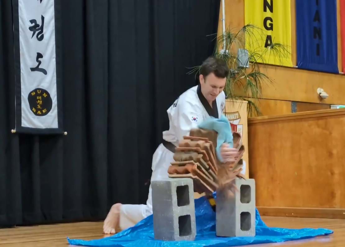 Taekwondo action - Sun Bae Korean Martial Art - Taekwondo Championship - Patterns, High Kick, Power Breaking, Roof Tiles, Kukkiwon, WT - World Taekwondo, Australia, Brisbane, Centres locations at Kenmore, Newmarket, The Gap, Middle Park, Mt Gravatt, Toowoomba, Grandmaster Bradley Tatnell. competition, white belt, yellow belt, blue belt, red belt, black belt, children, adults, male, female.